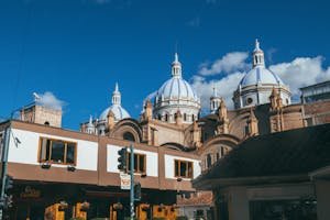 Magnificent view of Cuenca's Cathedral with iconic domes and clear blue sky.